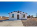 Charming single-story home featuring a crisp white exterior and desert landscaping at 245 E Date Ave, Casa Grande, AZ 85122