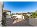 Inviting brick-paved patio with outdoor seating and views of the neighborhood at 26485 W Yukon Dr, Buckeye, AZ 85396