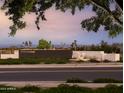 Community entrance showcasing lush landscaping and stone wall, sign reading 'The Preservation' at 3294 W Storm Cloud St, San Tan Valley, AZ 85144