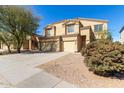 Charming two-story home featuring a three car garage and low-maintenance desert landscaping at 43608 W Kristal Ln, Maricopa, AZ 85138