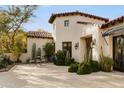Beautiful home featuring mature desert landscaping, stone walkways and a charming covered patio at 6640 E Kasba Cir, Paradise Valley, AZ 85253