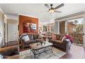 Open living room with hardwood floors, opens onto a balcony and an adjacent dining area at 7009 E Acoma Dr # 1113, Scottsdale, AZ 85254