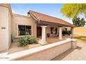 Covered front porch featuring classic columns and desert-style landscaping at 7820 S Maple Ave, Tempe, AZ 85284