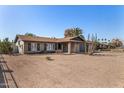 Attractive brick home with desert landscaping, shutters, and a two-car garage on a sunny day at 951 W La Jolla Dr, Tempe, AZ 85282