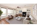 Cozy living room features a fireplace, built-in shelves, and modern furnishings at 9901 E Bahia Dr, Scottsdale, AZ 85260