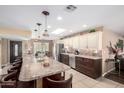 Spacious kitchen features an oversized island, stainless steel appliances, and modern lighting at 11010 W Acacia Dr, Sun City, AZ 85373