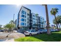 Modern apartment complex with multiple stories, balconies, and palm tree landscaping at 1130 N 2Nd St # 103, Phoenix, AZ 85004