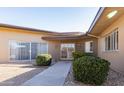 Charming home featuring desert landscaping, covered entry, and a tranquil, inviting facade at 13623 N 108Th Dr, Sun City, AZ 85351