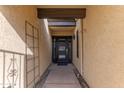 Covered front entry way with unique architecture and a stylish front door at 2212 W Claremont St, Phoenix, AZ 85015