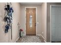 Inviting entryway with a decorative front door and tile flooring at 2798 W William Ln, San Tan Valley, AZ 85144