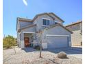 Well-maintained two-story home with neutral paint, a two-car garage, and gravel landscaping at 35771 W Costa Blanca Dr, Maricopa, AZ 85138