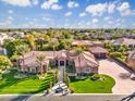 An aerial view highlighting the mature landscaping and the well manicured lawn at 3937 E Norcroft Cir, Mesa, AZ 85215