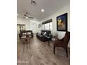 Inviting living room with wood floors, contemporary furnishings, and ample natural light at 4102 E Meadow Dr, Phoenix, AZ 85032