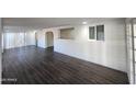 Bright living room with dark floors, white walls, and an open layout at 4508 E Alta Vista Rd, Phoenix, AZ 85042