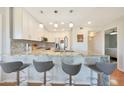 Modern kitchen featuring granite countertops, white cabinets and stainless steel appliances at 4850 E Desert Cove Ave # 333, Scottsdale, AZ 85254