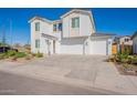 Charming two-story home with a three car garage and easy to maintain desert landscaping at 5038 W Cheryl Dr, Glendale, AZ 85302