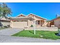 Beautiful single-story home featuring a well-kept lawn, two-car garage, and tiled roof at 5726 W Mercury Way, Chandler, AZ 85226