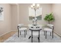 Bright dining room featuring modern table and chairs with natural lighting at 6713 E Elmwood St, Mesa, AZ 85205