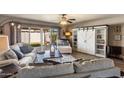 Inviting living room featuring modern furniture, and a sliding glass door with outdoor access at 7644 E Mariposa Dr, Scottsdale, AZ 85251