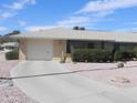 Charming single-story home featuring a two-car garage, low-maintenance landscaping, and a welcoming facade at 9806 W Long Hills Dr, Sun City, AZ 85351