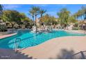 Beautifully maintained community pool with sparkling water and plenty of seating for residents and guests at 11000 N 77Th Pl # 1072, Scottsdale, AZ 85260