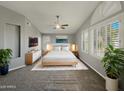 Serene main bedroom with neutral tones, plantation shutters, a ceiling fan and a king-size bed at 14645 S 25Th Pl, Phoenix, AZ 85048