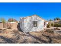 Side yard of home featuring low-maintenance desert landscaping with a gravel and stone ground cover at 1716 W Weldon Ave, Phoenix, AZ 85015