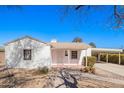 Charming single-story home with a light-colored exterior and a convenient covered carport at 1716 W Weldon Ave, Phoenix, AZ 85015