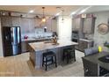 Modern kitchen featuring granite countertops, an island, and stainless steel appliances at 17743 W Robin Ln, Surprise, AZ 85387