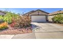 Charming single-story home with a two-car garage and desert landscaping at 22531 W Yavapai St, Buckeye, AZ 85326