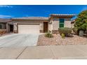 Well-maintained single-story home featuring desert landscaping and an attached two-car garage at 22754 W Moonlight Path, Buckeye, AZ 85326