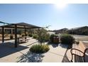 View of a park featuring shade structure, picnic table, grill and bench at 34598 N Elmwood Way, San Tan Valley, AZ 85144