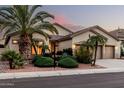 Charming single-story home featuring a spacious three-car garage, desert landscaping, and neutral color palette at 3887 E Andre Ave, Gilbert, AZ 85298