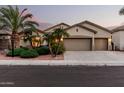 Charming single-story home featuring a spacious three-car garage, desert landscaping, and neutral color palette at 3887 E Andre Ave, Gilbert, AZ 85298