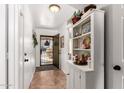 Inviting entryway showcasing stylish tile flooring and a charming built-in shelving unit at 468 E Wolf Hollow Dr, Casa Grande, AZ 85122