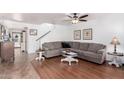 Comfortable living room with a ceiling fan, neutral tones and stylish flooring at 468 E Wolf Hollow Dr, Casa Grande, AZ 85122