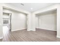 Bright, open living room featuring wood-look flooring and neutral paint at 4926 S Hemet St, Gilbert, AZ 85298