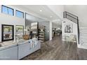 Bright open-concept living room features a fireplace, modern decor, and seamless access to other rooms at 5601 E Caballo Dr, Paradise Valley, AZ 85253