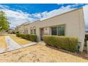 Attractive home with a well-maintained lawn and neatly trimmed hedges leading to the entrance at 5809 E Thomas Rd, Scottsdale, AZ 85251