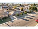 Aerial view of a single-story home with a covered carport in a residential neighborhood, surrounded by lush landscaping at 6808 N 33Rd Ave, Phoenix, AZ 85017