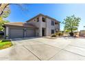 Spacious home with a three car garage and a well manicured lawn at 7401 W Arrowhead Clubhouse Dr # 1052, Glendale, AZ 85308