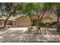 Attractive single-story home with a two-car garage and desert-friendly landscaping at 7635 E Pampa Ave, Mesa, AZ 85212