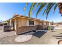 Cozy single-story home with mature landscaping and brick accents at 10329 W Floriade Dr, Sun City, AZ 85351