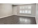 Inviting room with shuttered window and modern flooring at 10562 W Campana Dr, Sun City, AZ 85351
