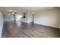 Bright open concept living space with modern floors and neutral paint at 10562 W Campana Dr, Sun City, AZ 85351