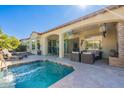 Back patio and pool with covered sitting area with lots of shade at 1488 E Sweet Citrus Dr, Queen Creek, AZ 85140