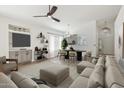 Bright, open-concept living room with modern furnishings, wood-look floors, and ample natural light at 3027 N 83Rd Pl, Scottsdale, AZ 85251