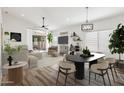 Spacious living area with stylish decor, wood floors, and a sliding glass door to the backyard at 3027 N 83Rd Pl, Scottsdale, AZ 85251