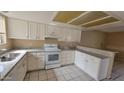 Bright kitchen featuring white cabinets and countertops at 433 E Utopia Rd, Phoenix, AZ 85024