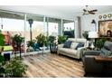 Bright living room with hardwood floors and sliding glass doors leading to the backyard at 808 E Constance Way, Phoenix, AZ 85042